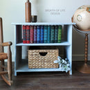 A nightstand with 2 open shelves refurbished by Breath of Life Design features Dixie Belle's Bay Breeze Silk All-In-One Mineral Paint.