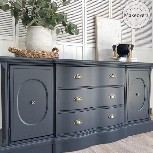 A large dresser with 3-drawers and 2 doors refurbished by My Little Makeovers features Dixie Belle's Black Sands Silk All-In-One Mineral Paint.
