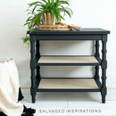 A vintage side table with 2 shelves refurbished by Salvaged Inspirations features Dixie Belle's Black Sands Silk All-In-One Mineral Paint.
