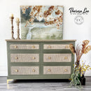 A 6-drawer dresser refurbished by Theresa Lee NTS Design Company features Dixie Belle's Cactus Silk All-In-One Mineral Paint and wicker on the drawer inlays.