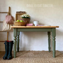 A small country style kitchen table refurbished by Annie Loveday Furniture features Dixie Belle's Cactus Silk All-In-One Mineral Paint and a natural wood table top.