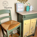 A vintage rolling bar cart and wood counter chair refurbished by Vintage Junk to Funk feature Dixie Belle's Cactus Silk All-In-One Mineral Paint.
