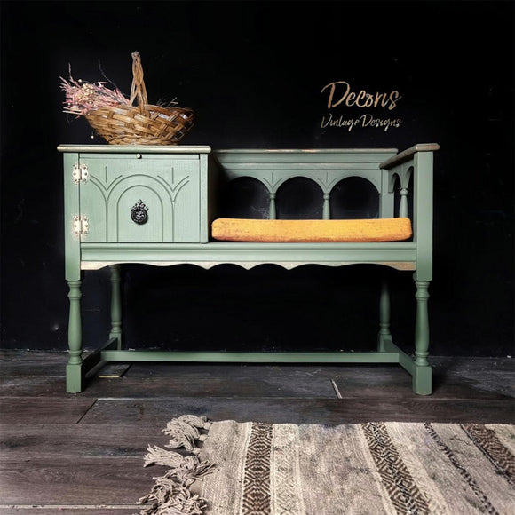 A vintage phone sitting bench refurbished by Decoris Vintage Designs features Dixie Belle's Cactus Silk All-In-One Mineral Paint.