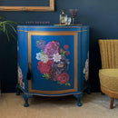 A vintage end table with storage refurbished by Faff Designs features Dixie Belle's Cape Current Silk All-In-One Mineral Paint with gold and floral accents