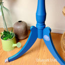 A close-up of a small side table's base refurbished by Vintage Junk to Funk features Dixie Belle's Cape Current Silk All-In-One Mineral Paint. 