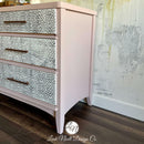 An angled side view of a large dresser refurbished by Leah Noell Design Company features Dixie Belle's Conch Silk All-In-One Mineral Paint.