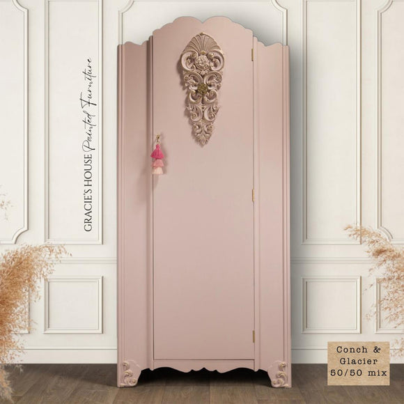 A vintage armoire refurbished by Gracie's House Painted Furniture features a 50/50 mix of Dixie Belle's Conch and Glacier Silk All-In-One Mineral Paints.