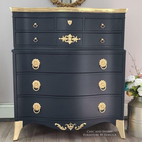 A 9-drawer lingerie dresser refurbished by Chic and Shabby Furniture by Rebecca features Dixie Belle's Deep Sea Silk All-In-One Mineral Paint and gold accents.