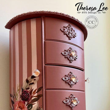 A tall vintage jewelry box refurbished by Theresa Lee NTS Design Company features Dixie Belle's Desert Rose Silk All-In-One Mineral Paint.