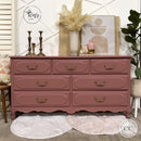 A large 7-drawer dresser refurbished by Why Not ReDesign features Dixie Belle's Desert Rose Silk All-In-One Mineral Paint.