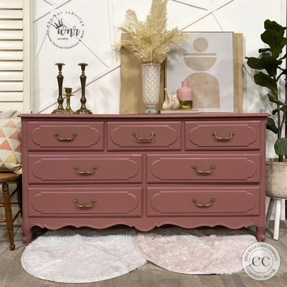 A large 7-drawer dresser refurbished by Why Not ReDesign features Dixie Belle's Desert Rose Silk All-In-One Mineral Paint.