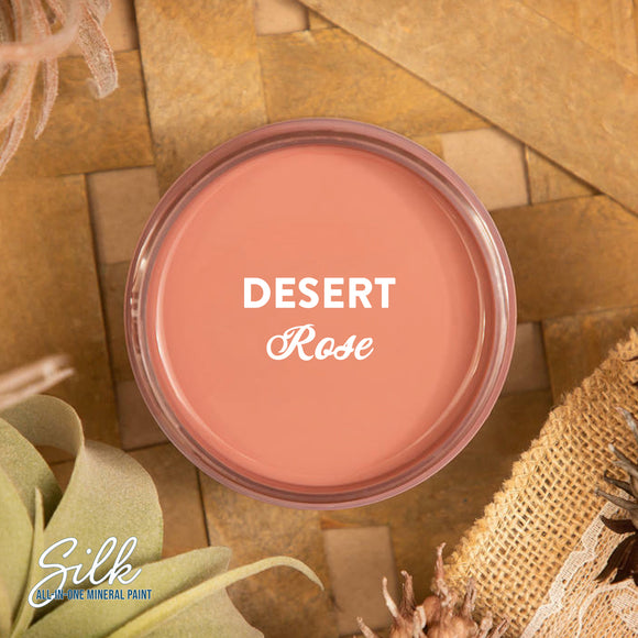 An arial view of an open container of Dixie Belle Paint Company's Desert Rose Silk All-In-One Mineral Paint is shown with white text reading Desert Rose.
