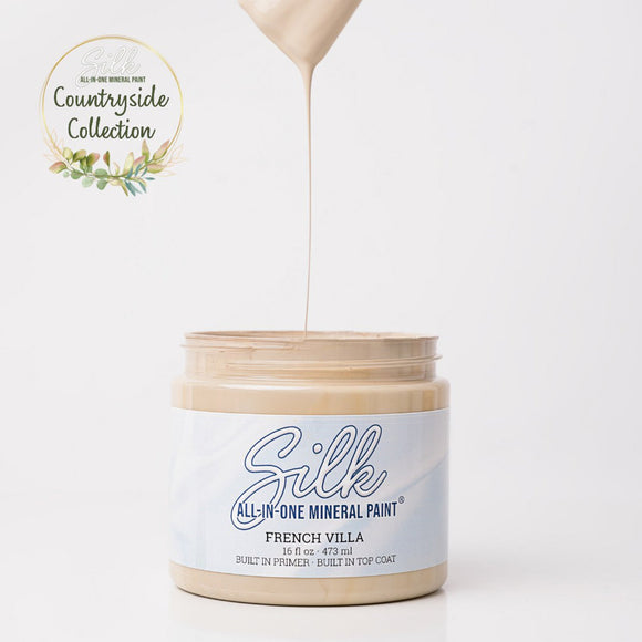 Jar of Silk All-in-One Mineral Paint with a droplet of paint on a white background