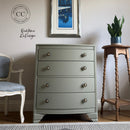 Gray dresser with decorative elements in a room setting