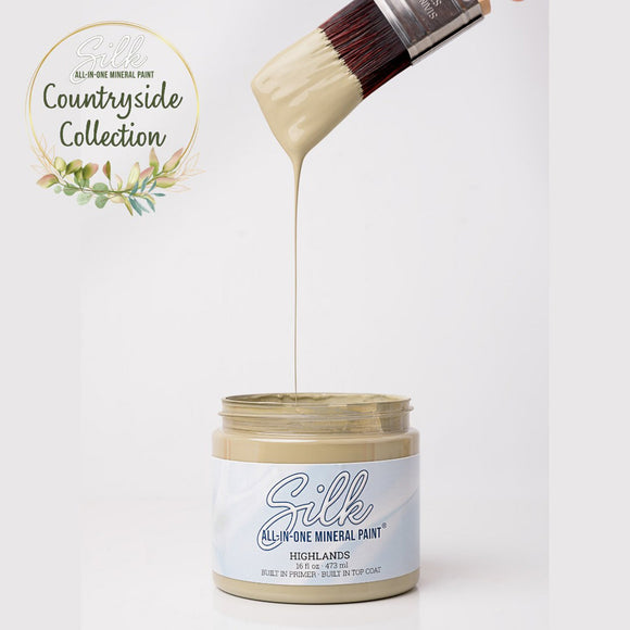 Silk All-in-One Mineral Paint being applied with a brush from a jar, on a white background with 'Countryside Collection' text.