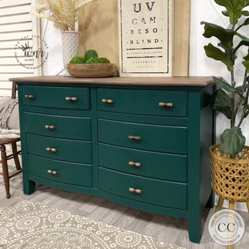 A large 8-drawer dresser refurbished by Why Not ReDesign features Dixie Belle's Midnight Green Silk All-In-One Mineral Paint with a natural wood top.