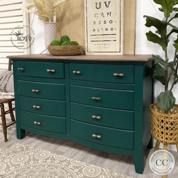 A large 8-drawer dresser refurbished by Why Not ReDesign features Dixie Belle's Midnight Green Silk All-In-One Mineral Paint with a natural wood top.