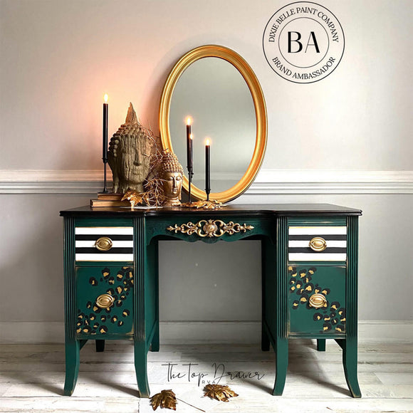 A vintage vanity desk refurbished by The Top Drawer features Dixie Belle's Midnight Green Silk All-In-One Mineral Paint.