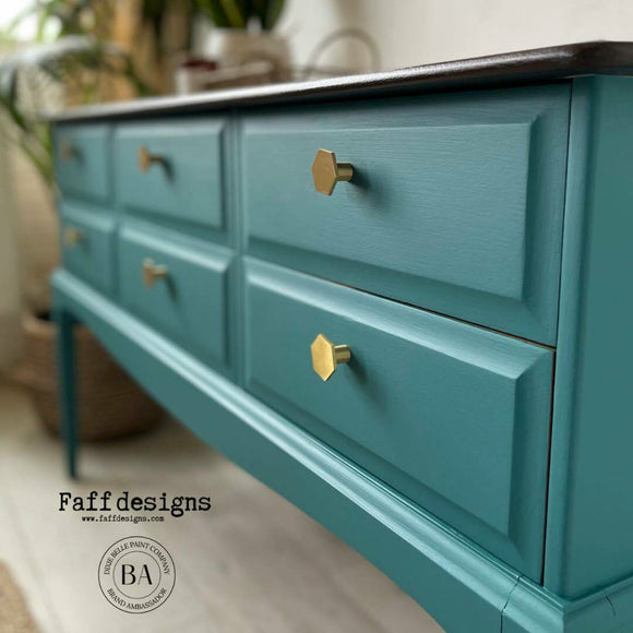 A close-up view with a vintage 6-drawer console table refurbished by Faff Designs features Dixie Belle's Mirage Silk All-In-One Mineral Paint.