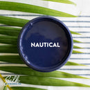 An arial view of an open container of Dixie Belle Paint Company's Nautical Silk All-In-One Mineral Paint is shown with white text reading Nautical.