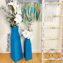 Two tall vases refurbished by Vintage Junk to Funk are painted in Dixie Belle's Oasis All-In-One Mineral Paint.