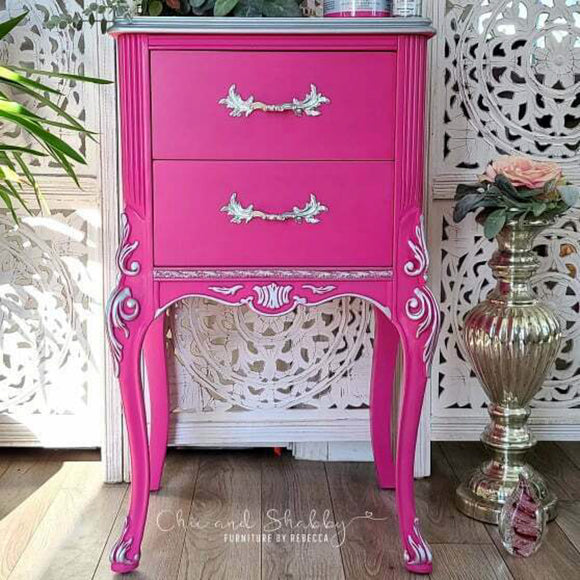 A vintage 2-drawer night stand refurbished by Chic and Shabby Furniture by Rebecca has silver details and features Dixie Belle's Prickly Pear Silk All-In-One Mineral Paint.
