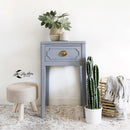 A vintage 1-drawer nightstand refurbished by Lilly Moon Vintage features Dixie Belle's Quiet Cove Silk All-In-One Mineral Paint.