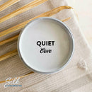 An arial view of an open container of Dixie Belle Paint Company's Quiet Cove Silk All-In-One Mineral Paint is shown with black text reading Quiet Cove.