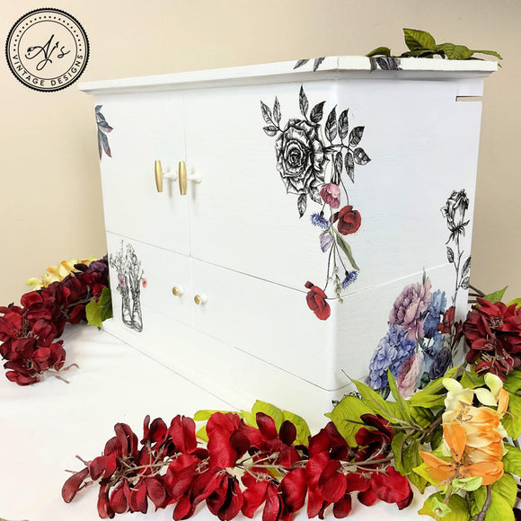 A table top jewelry box with floral transfers refurbished by AJ's Vintage Designs features Dixie Belle's Salt Water Silk All-In-One Mineral Paint.
