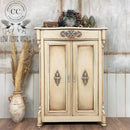 A vintage bar cabinet refurbished by Low Flying Angels features Dixie Belle's Sand Castle Silk All-In-One Mineral Paint.