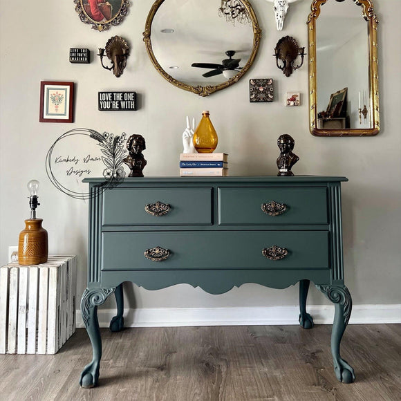 A vintage 3-drawer dresser with tall fancy legs refurbished by Kimberly Dawn Designs features Dixie Belle's Smoky Mountains Silk All-In-One Mineral Paint.