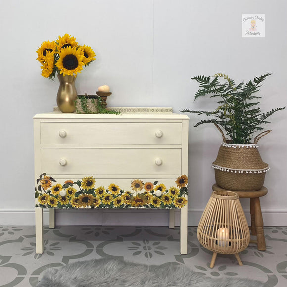 A 3-drawer dresser refurbished by Cherubs Chalks Interiors features Dixie Belle's Sun Kissed Silk All-In-One Mineral Paint.