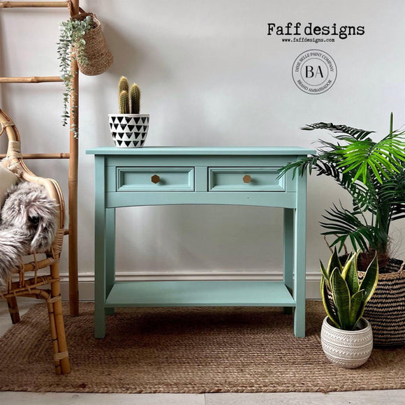 A 2-drawer side table refurbished by Faff Designs features Dixie Belle's Tide Pool Silk All-In-One Mineral Paint.