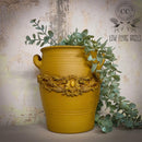 A milk can planter refurbished by Low Flying Angels features Dixie Belle's Yellowstone Silk All-In-One Mineral Paint.