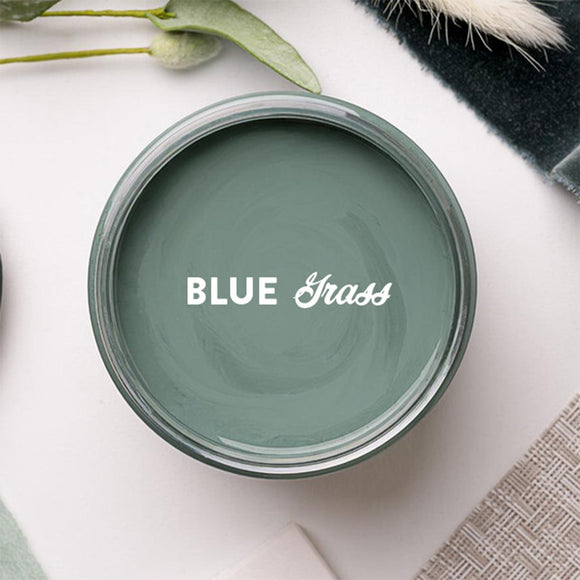 An arial view of an open container of Dixie Belle Paint Company's Blue Grass Chalk Mineral Paint is shown with white text reading Blue Grass.