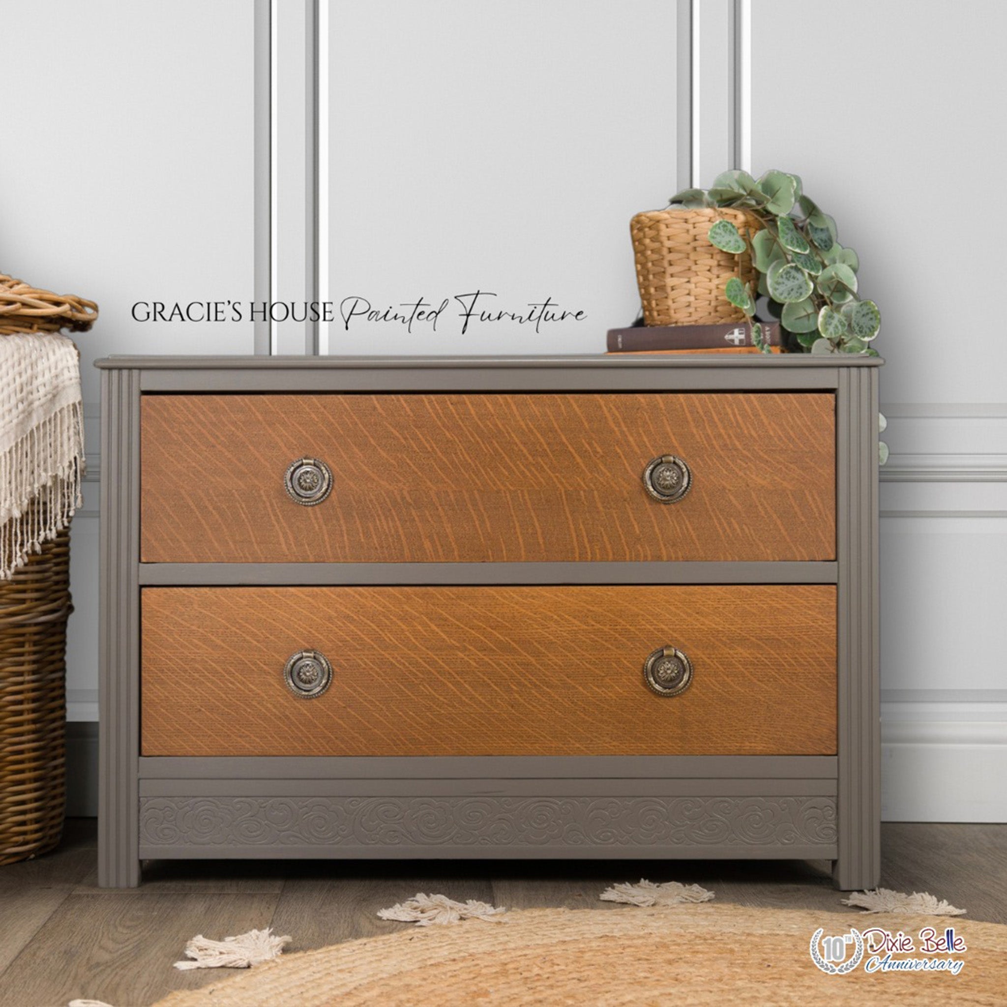 A 2 drawer small dresser refurbished by Gracie's House Painted Furniture has 2 natural wood drawers and the dresser is painted with Dixie Belle's Hurricane Gray chalk mineral paint.