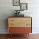 A vintage night stand refurbished by Breath of Life Design has 2 natural wood drawers and features Dixie Belle Paint's Rusty Nail Chalk Mineral Paint on the rest of the unit.