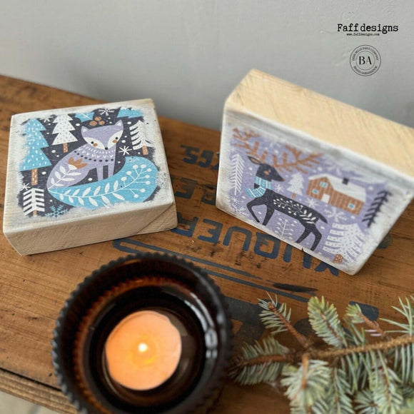 Two wood blocks created by Faff Designs feature Belle & Whistles' Nordic Noel rice paper on them.