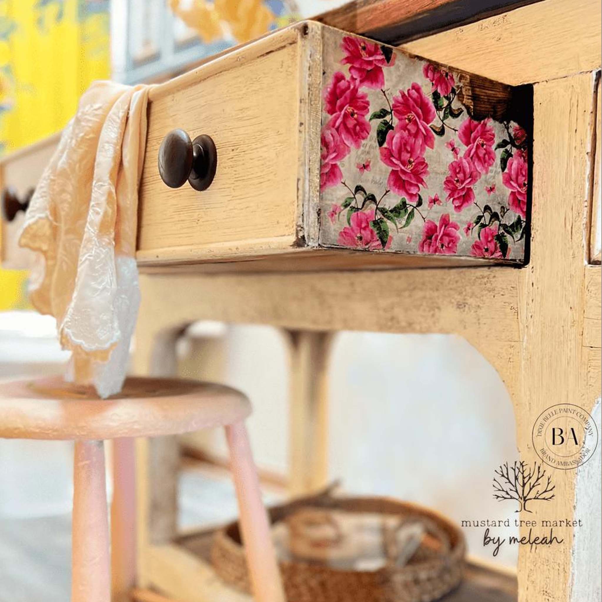 A vintage desk refurbished by Mustard Tree Market by Meleah is painted beige and features Belles and Whistles Vintage Wallpaper A1 rice paper on the side of one of its drawers.