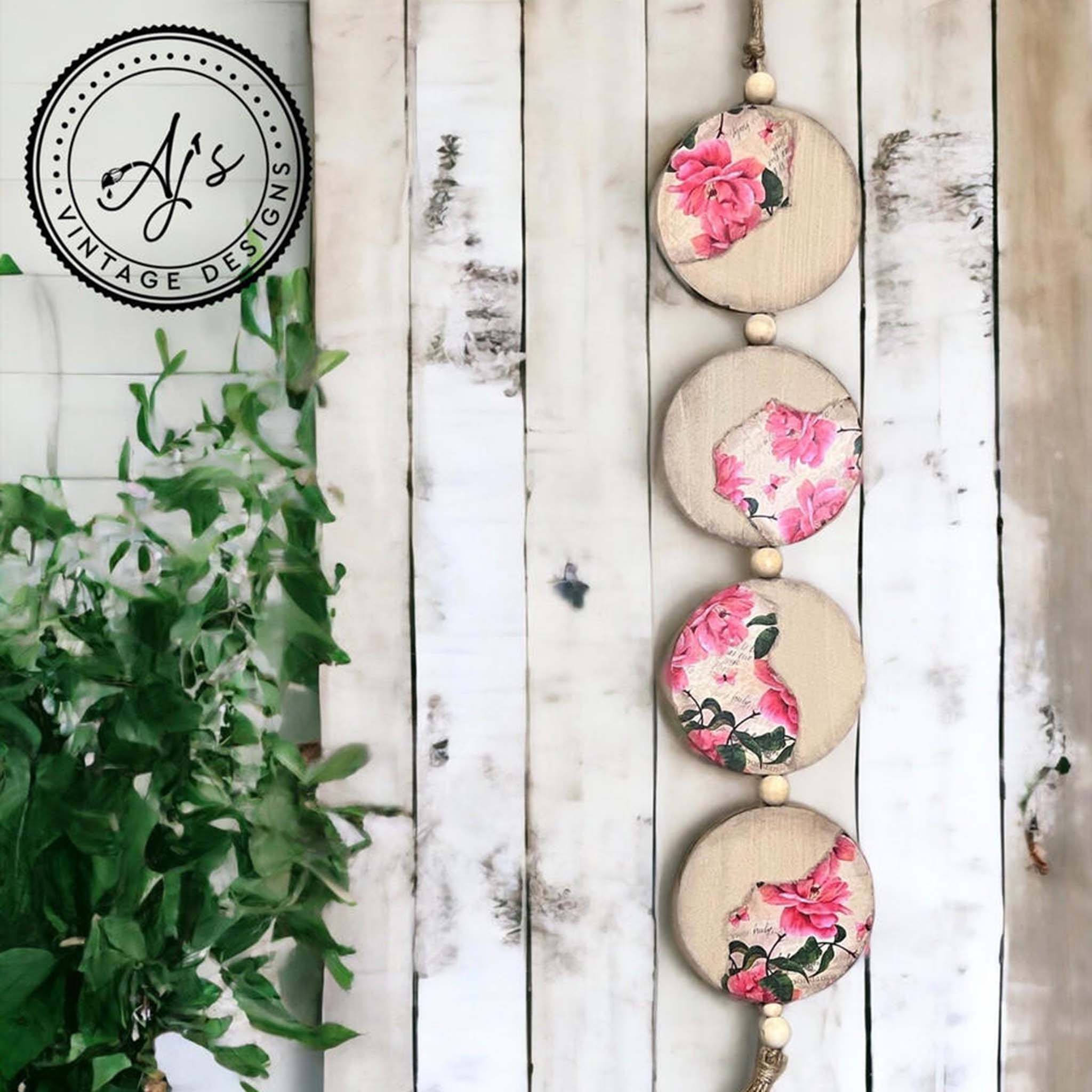 A wood hanging decor with 4 large wood rounds created by Aj's Vintage Designs feature Belles and Whistles Vintage Wallpaper A1 rice paper.