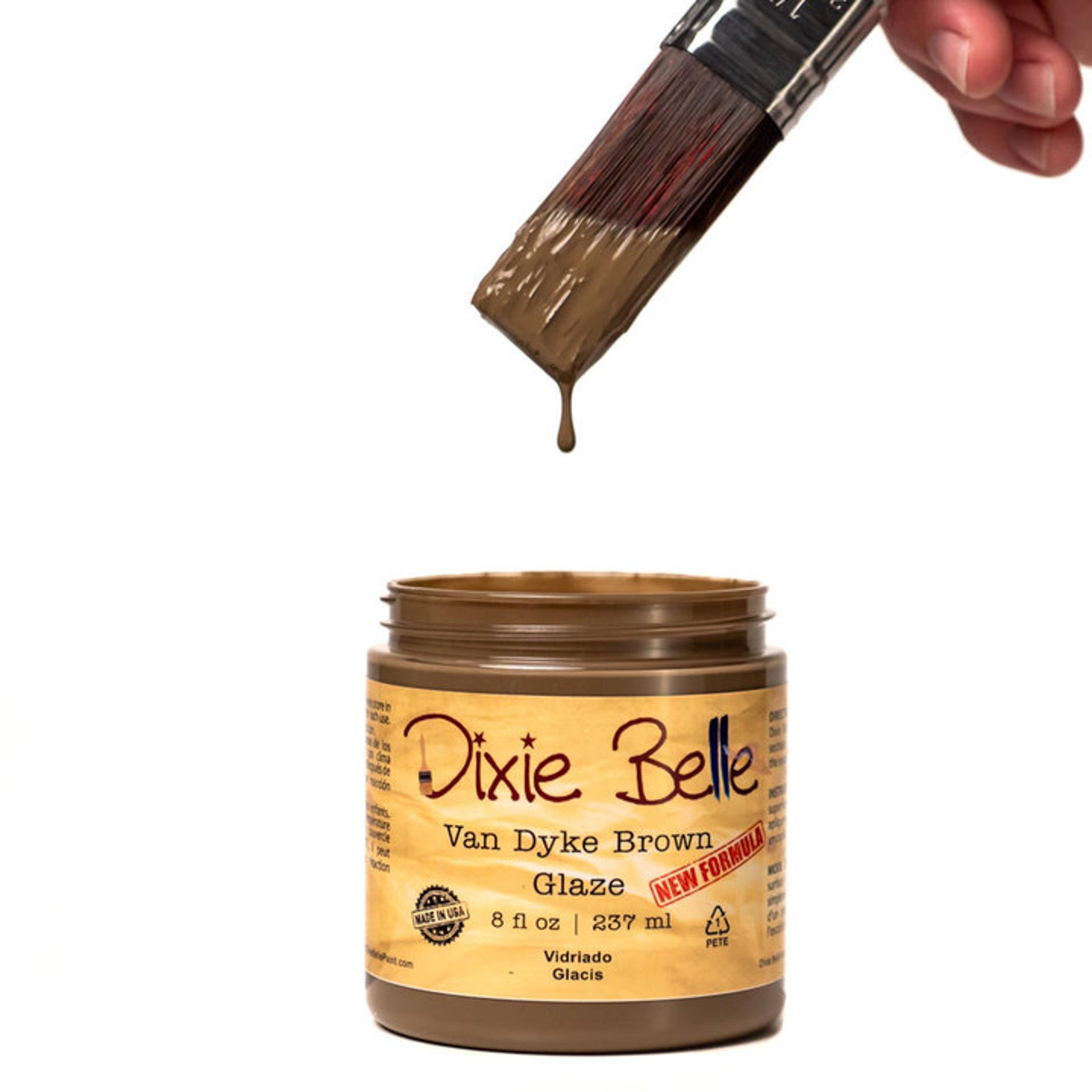 An open container of an 8oz/237ml Dixie Belle Van Dyke Brown Glaze with a dripping paintbrush above it is against a white background.