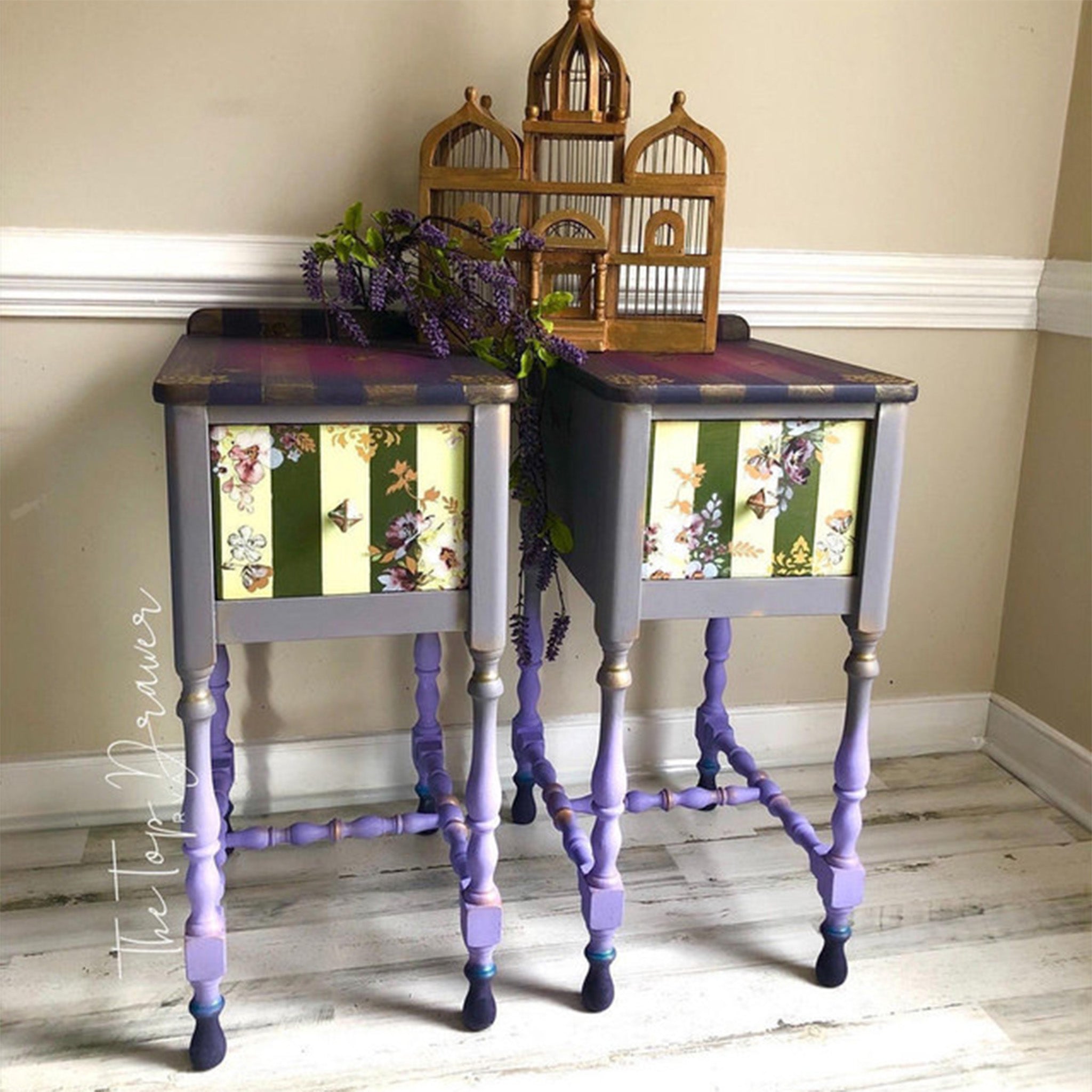 Two vintage nightstands refurbished by The Top Drawer are painted grey and lavender and feature accents of Dixie Belle Paint's Gold Shimmer Glaze.