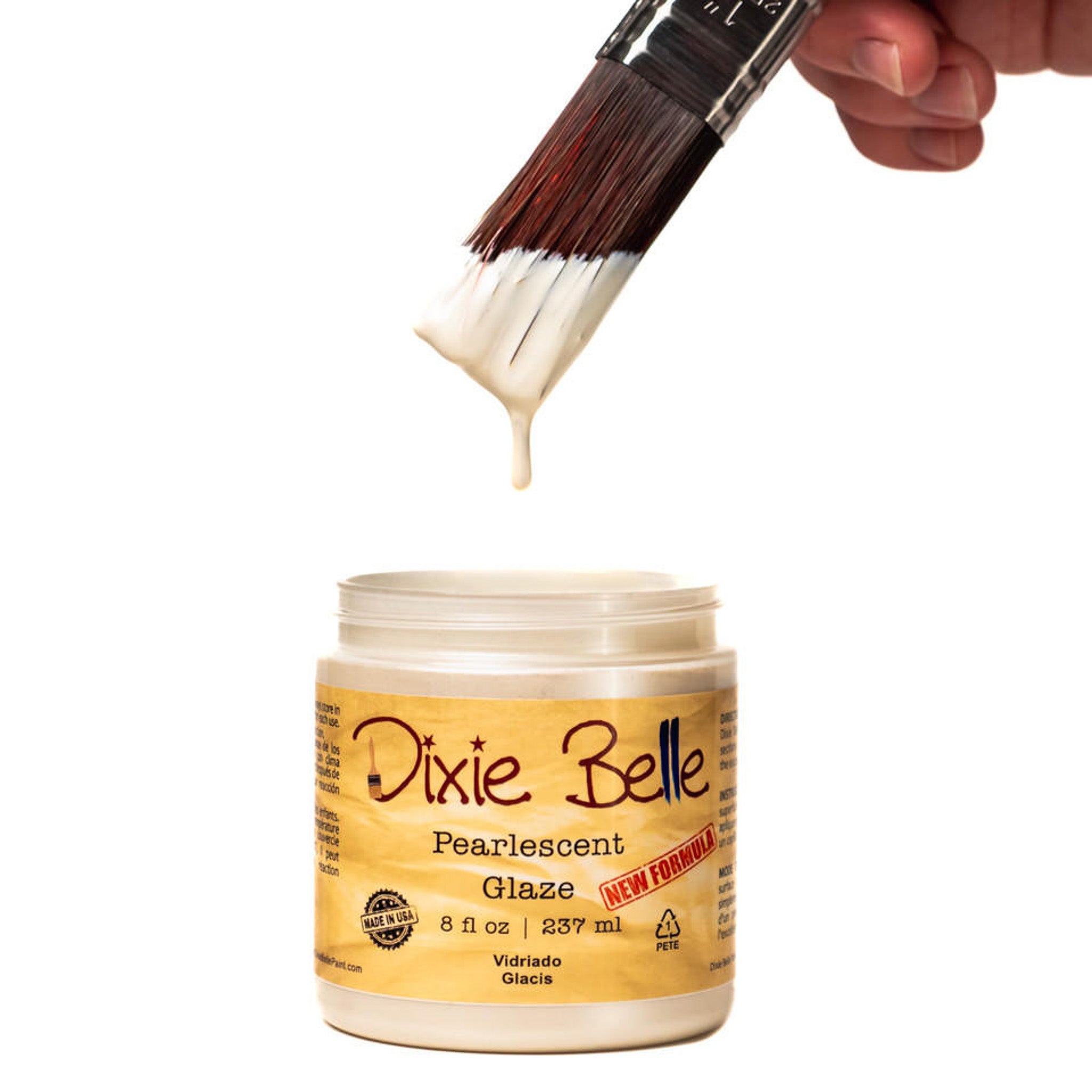 An open container of an 8oz/237ml Dixie Belle Pearlescent Glaze with a dripping paintbrush above it is against a white background.