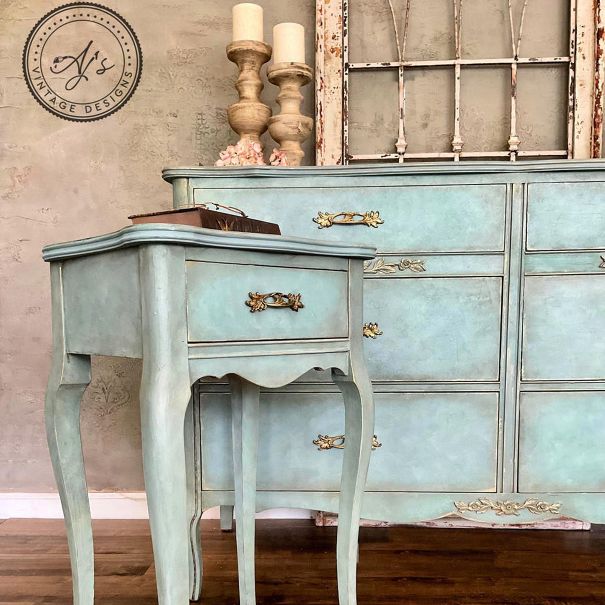 A vintage 1-drawer nightstand and a large dresser refurbished by AJ's Vintage Designs are painted a blend of pale blue and light grey and features Dixie Belle Paint's Pearlescent Glaze highlights on them.