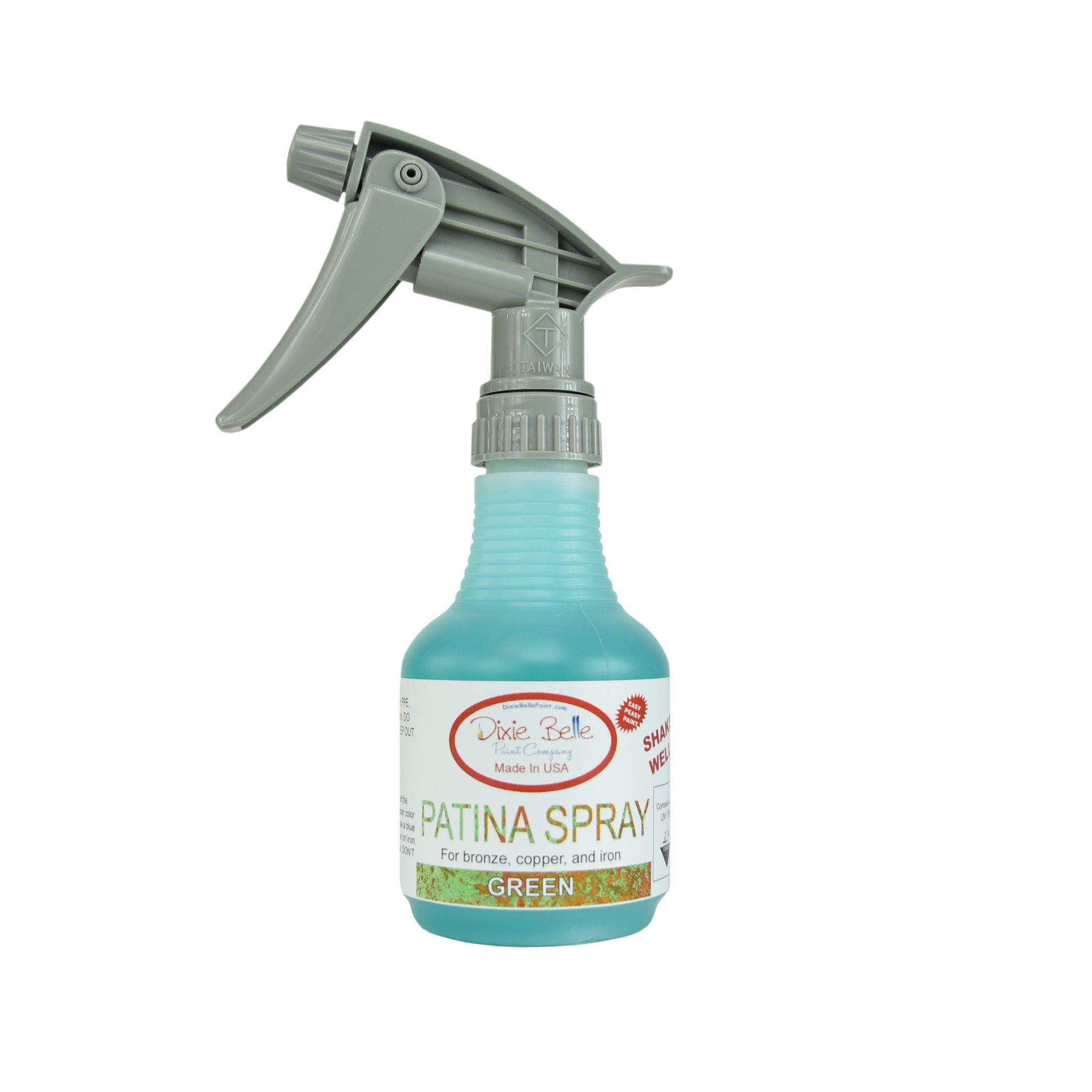 An 8oz spray bottle of Dixie Belle Paint Company's Patina Spray in Green is against a white background.