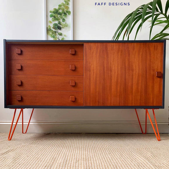 A mid century modern console table with storage refurbished by Faff Designs is painted partially black and features Dixie Belle Paint's Howdy Do Hemp Seed Oil over natural wood.