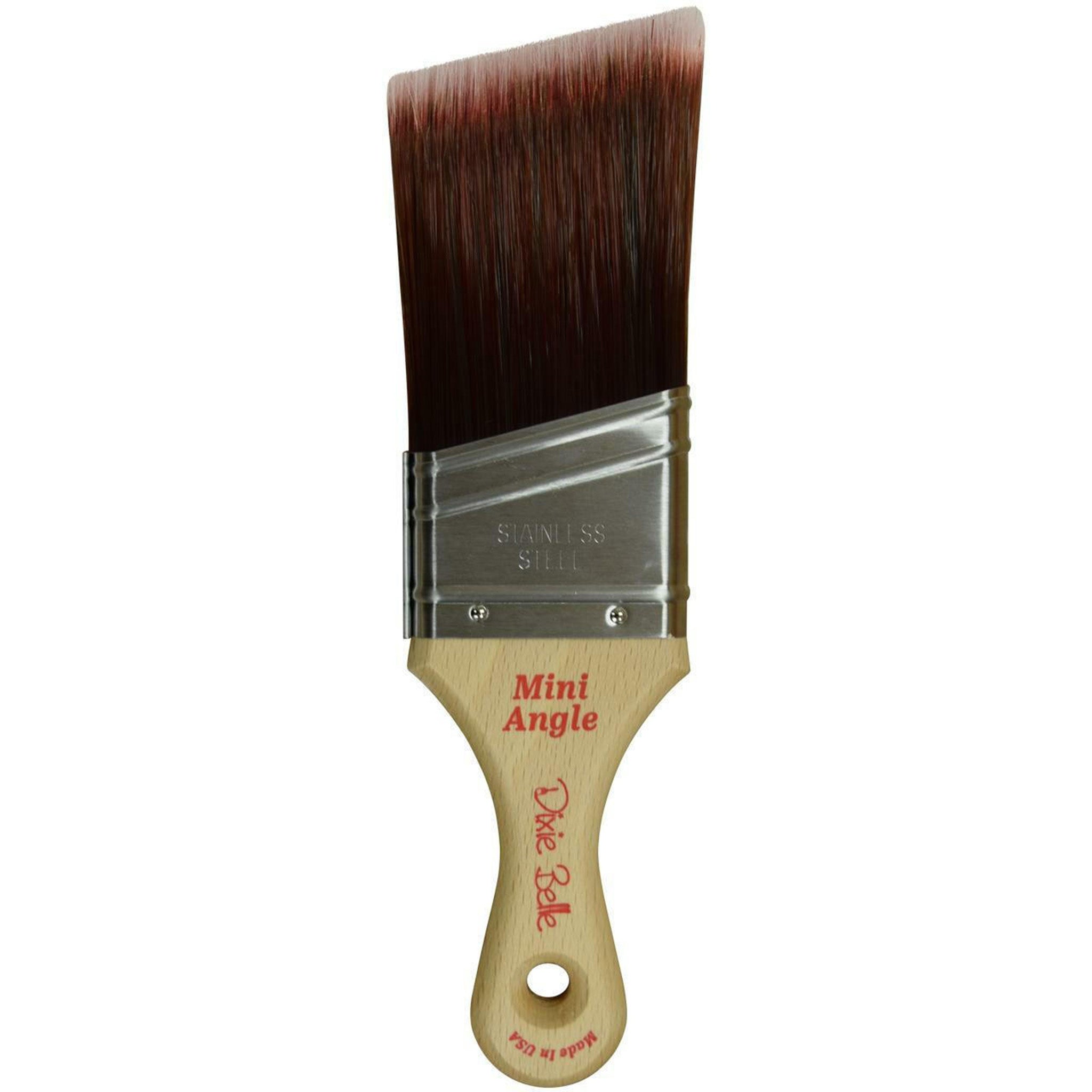 A wood handled paint brush with angled bristles is against a white background.