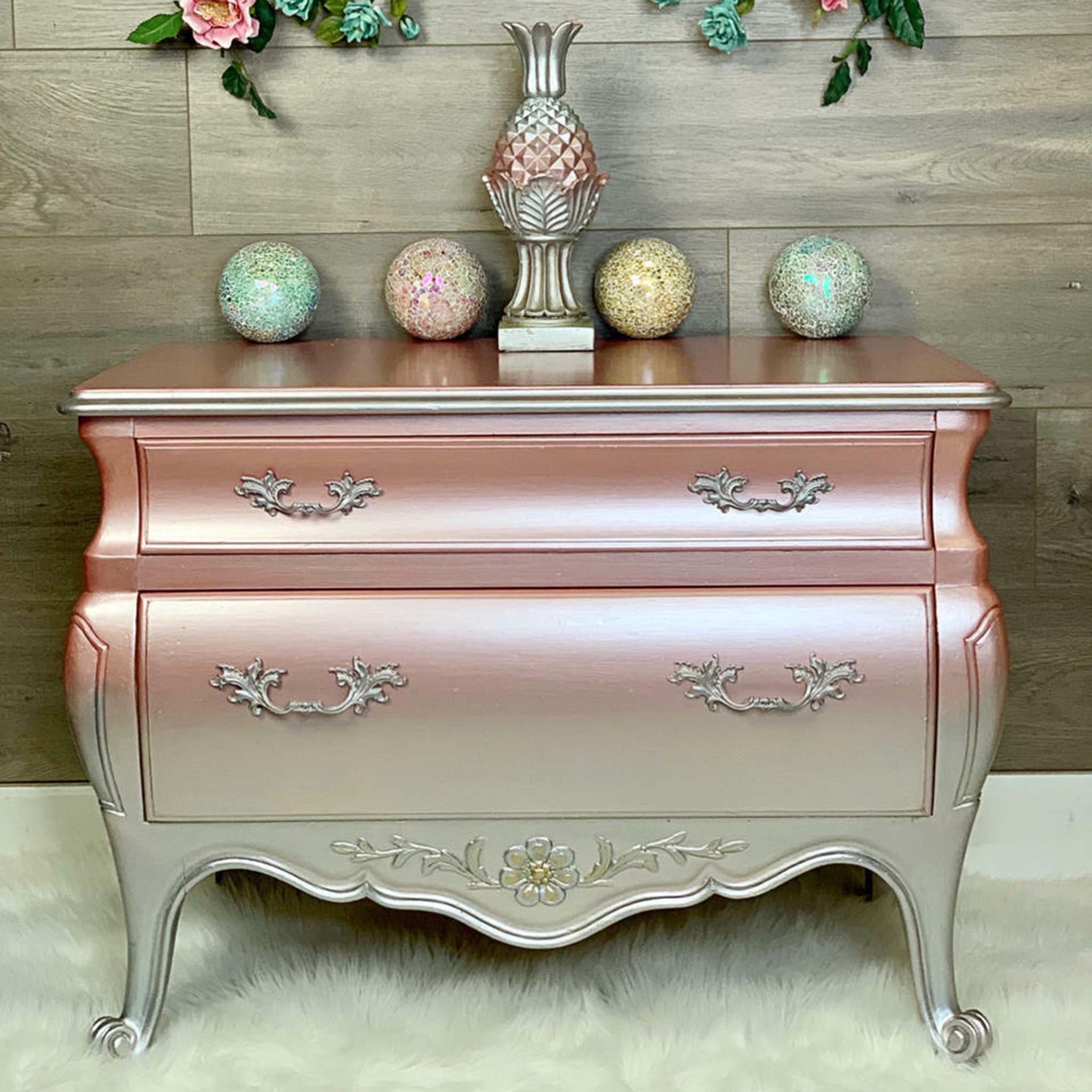 A vintage Bombay style 2-drawer dresser is painted in Dixie Belle's Moonshine Metallics paint in Rozay ombred own to Silver Bullet