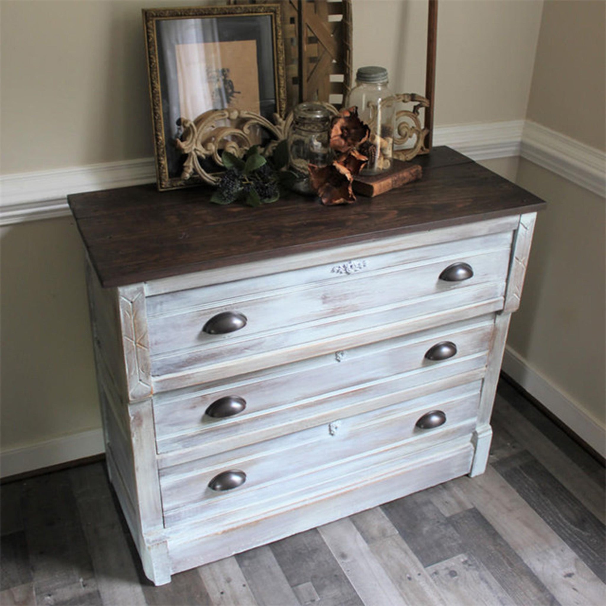 A 3-drawer dresser features 2 colors of Dixie Belle Paint's No Pain Gel Stain.