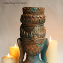 The backside of a statue head with ornate details refurbished by Sisterhood Furniture features Dixie Belle's Patina Paints on it.